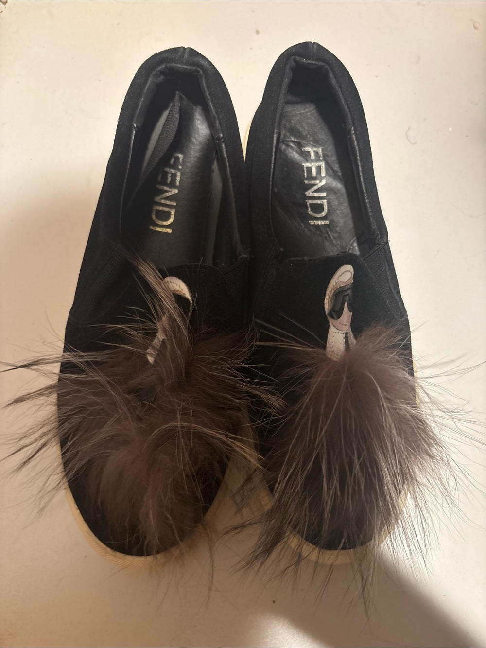 Fendi Black Slip-On Mules with Brown Fur Pom Detail